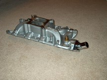 Cleaned and painted intake with new fittings.